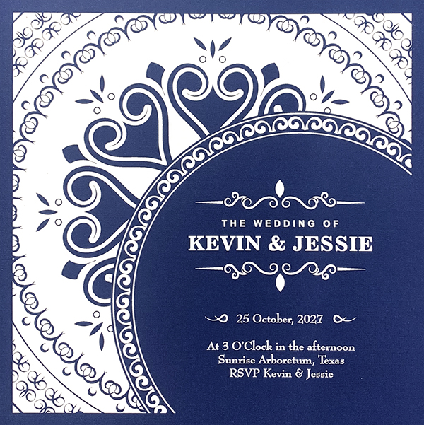 White ink invitation on blue paper
